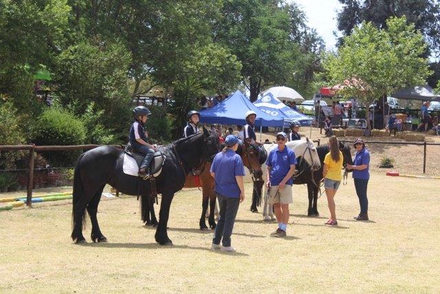 Pupils from nine schools ride horses for the dissabled at The Earth Centre during Sarda's Fun Day